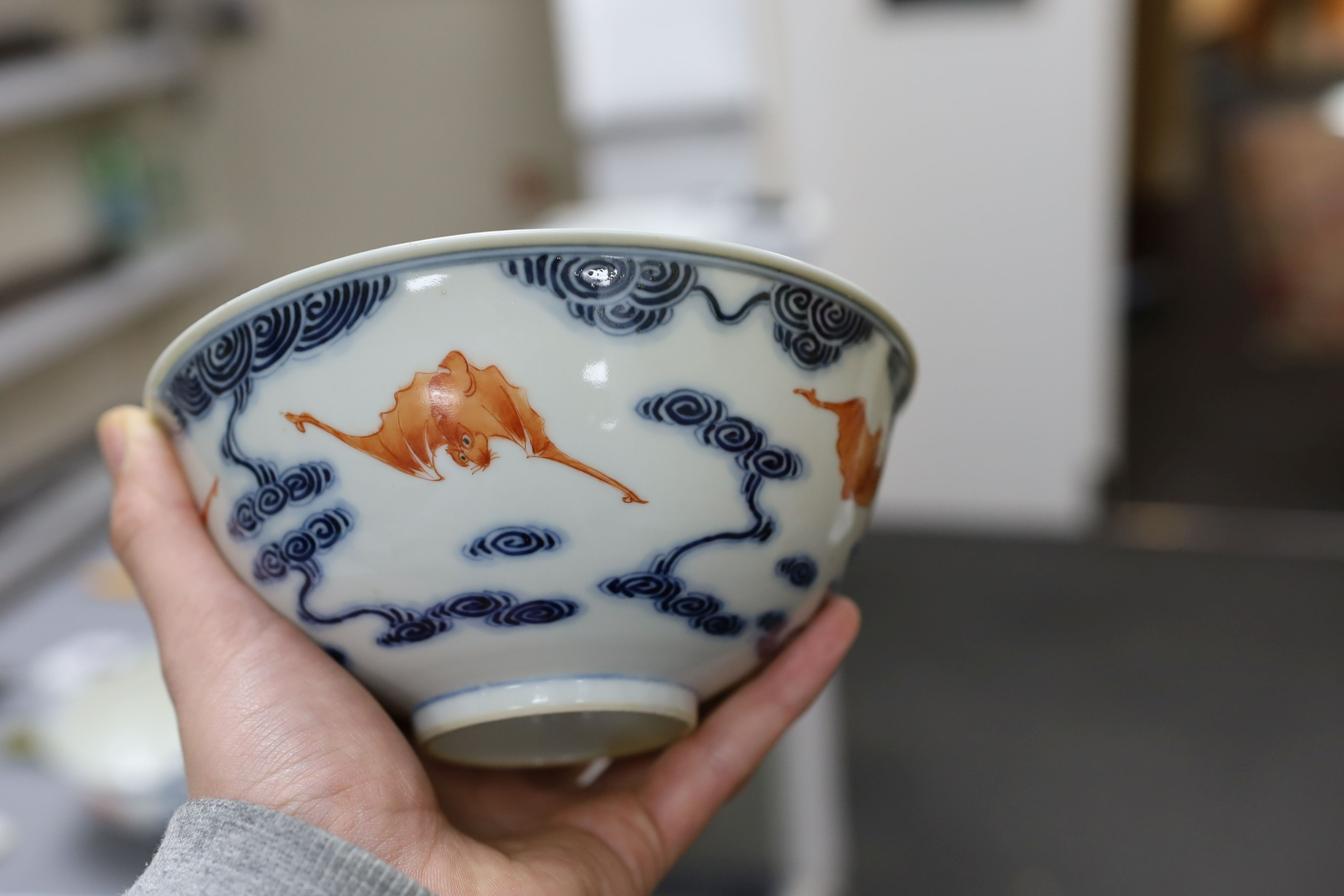 A pair of Chinese iron red and underglaze blue ‘five bat’ bowls, Guangxu mark and probably of the period (1875-1908), 16.5cm diameter